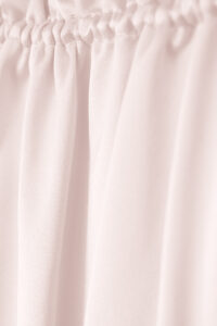 Elastic band detail of MANITO Sophia silk nightdress in an ballet pink color.