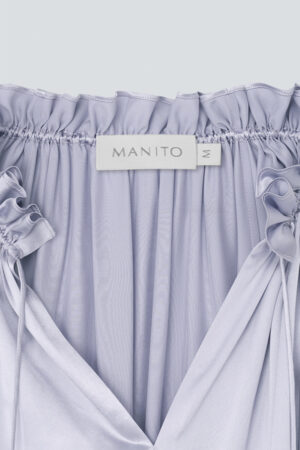 Neckline detail of MANITO Sophia silk nightdress in an orchid petal color.