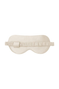 Back view of the Sweet Garden Silk Eye Mask showing the smooth almond beige silk and elastic band.