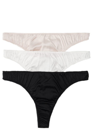 Set of Tacetto silk briefs in pink, white, and black, arranged flat to highlight minimalist elegance and premium fabric.