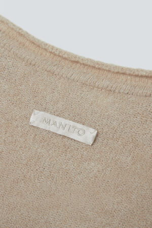 Close-up of Teddy Women's Cotton Wool Knit Lounge Set back label with MANITO logo on textured knit fabric.