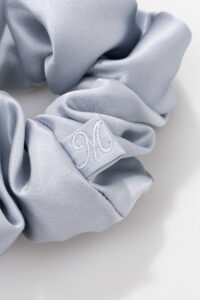 Dove-grey Thick Silk Scrunchie detail showing low-friction silk that's gentle on hair.