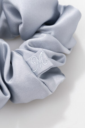 Dove-grey Thick Silk Scrunchie detail showing low-friction silk that's gentle on hair.