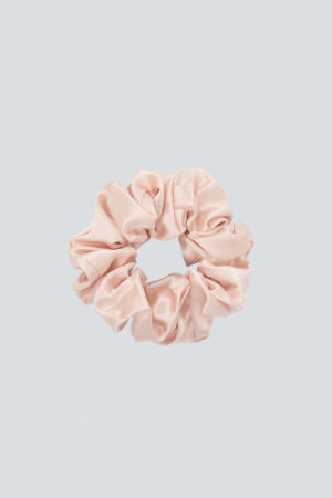 Thick Silk Scrunchie in pink delivers a romantic finish with silky, cushiony volume.