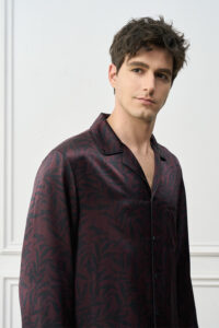 Side view of Tropical Leaves Men's Pajama Set, flowing silk drape and botanical motif evoke serene evening comfort.