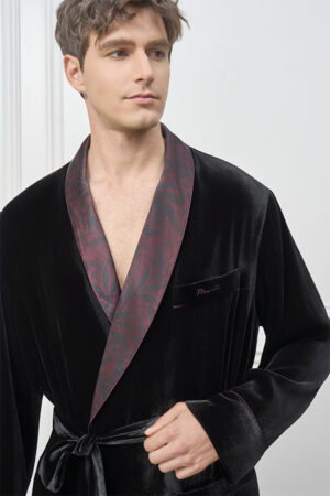 Model wearing the Tropical Leaves Velvet Men's Robe, highlighting the patterned shawl collar and soft black velvet texture.