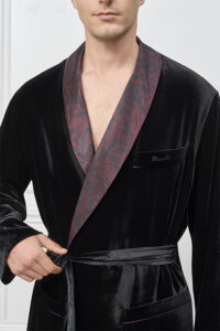 Close-up of the Tropical Leaves Velvet Men's Robe front, showcasing the patterned lapel, embroidered pocket, and velvet belt tie.
