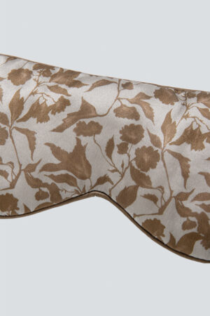 Close-up of the front of MANITO Tropical Silk Eye Mask in light taupe color.