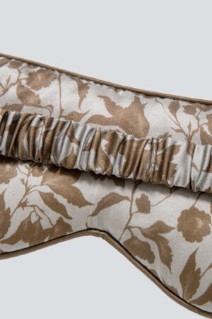 Back of MANITO Tropical Silk Eye Mask in light taupe color, showing the same floral pattern and its secure strap.
