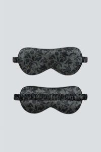 Overview of MANITO Tropical Silk Eye Mask in vetiver color, the top showing the floral design front and the bottom.