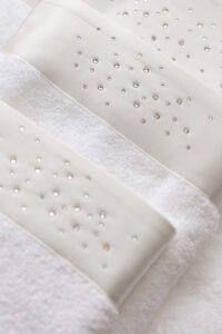Twinkle 3 Pieces Bath Towel Set showing elegant rhinestone pattern on silk trim for refined bathroom décor.