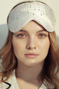 Model wears MANITO Twinkle Silk Eye Mask with crystal embellishments, showing elegant design and soft silk texture.
