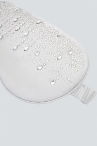 Close-up of silver MANITO Twinkle Silk Eye Mask featuring sparkling crystal details.