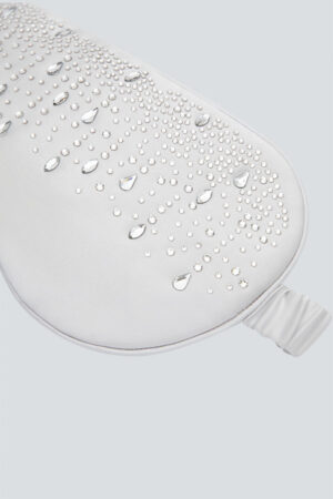 Close-up of silver MANITO Twinkle Silk Eye Mask featuring sparkling crystal details.