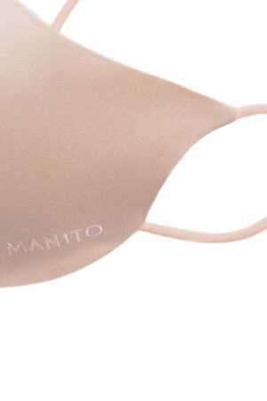 Close-up of pink MANITO Ultra Silk Face Mask, showing smooth silk texture and subtle logo embroidery.