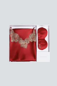 MANITO wedding dress gift box displayed, featuring a luxurious red silk camisole with lace accents.