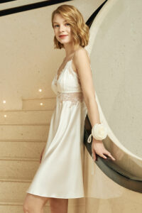 MANITO Wedding V-neck Lace Silk Mini Dress with floral corsage accent and side profile.