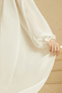 Full rear view of MANITO Wedding Women's Ruffle Silk Robe on model, capturing the smooth fit and elegant back cut.