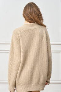 Back view of woman wearing Wunder Cardigan, highlighting its relaxed drape and plush ribbed finish.