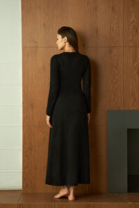 Back view of the black Wunder Knit Dress, revealing its sleek silhouette and refined fit.