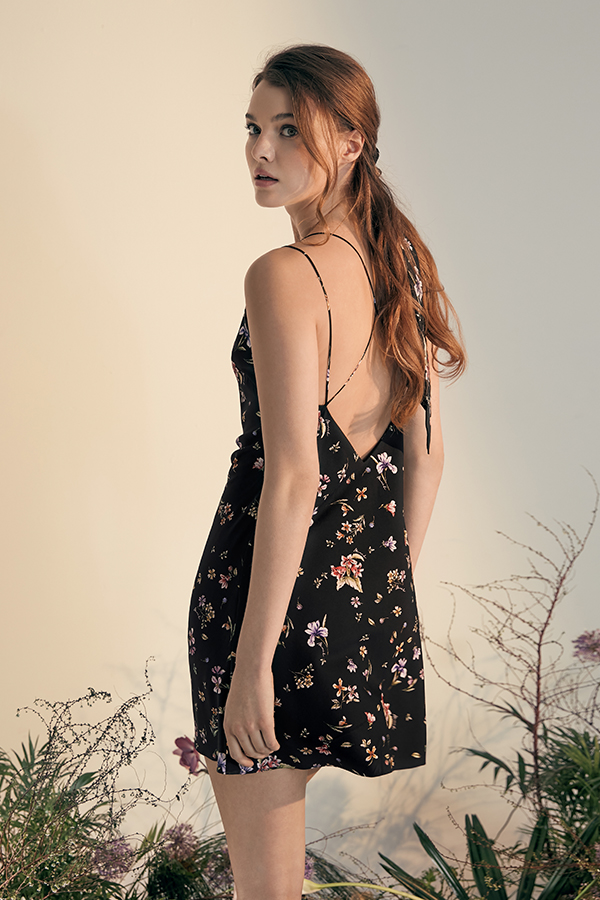 Lrisette Bow Mini Slip Dress with floral pattern, silk material, and delicate back strap design.