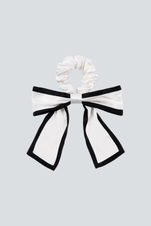 Double Color Silk Scrunchie features a two-color patchwork design that redefines the classic bow look.