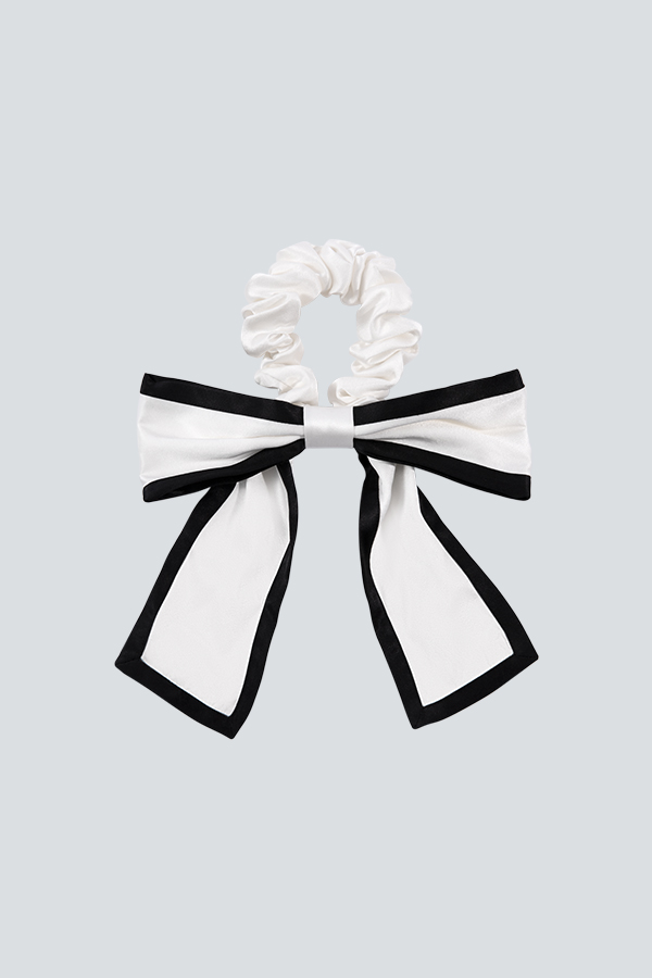 Double Color Silk Scrunchie features a two-color patchwork design that redefines the classic bow look.