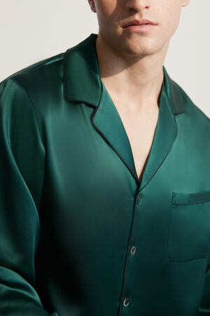 Close-up of a man in an Authentic Green Silk Pajama Set, showing collar and pocket details.