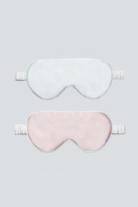 Soft blue and pink silk eye masks for kids with gentle elastic band.