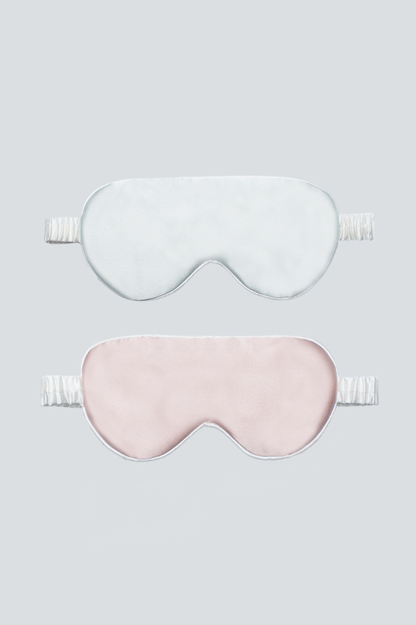Soft blue and pink silk eye masks for kids with gentle elastic band.