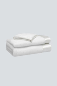 MANITO Brimmy 3 Piece Bath Towel Set with white silk trim, showcasing classic minimalism and softness.
