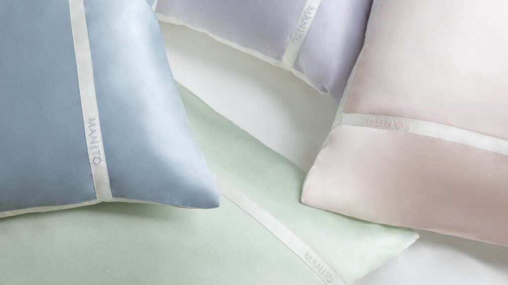 Array of MANITO silk pillowcases in various colors