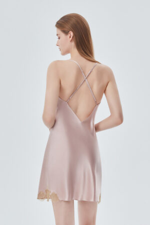 Back view of the lace-trimmed silk dress, showcasing the crisscross design on the back of the dress.