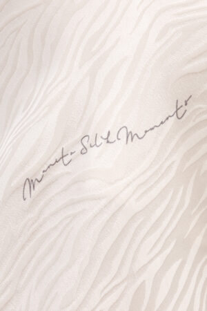 Fabric close-up of MANITO Jungle Tiger Print Short Pajama Set highlighting tiger-inspired jacquard silk design.