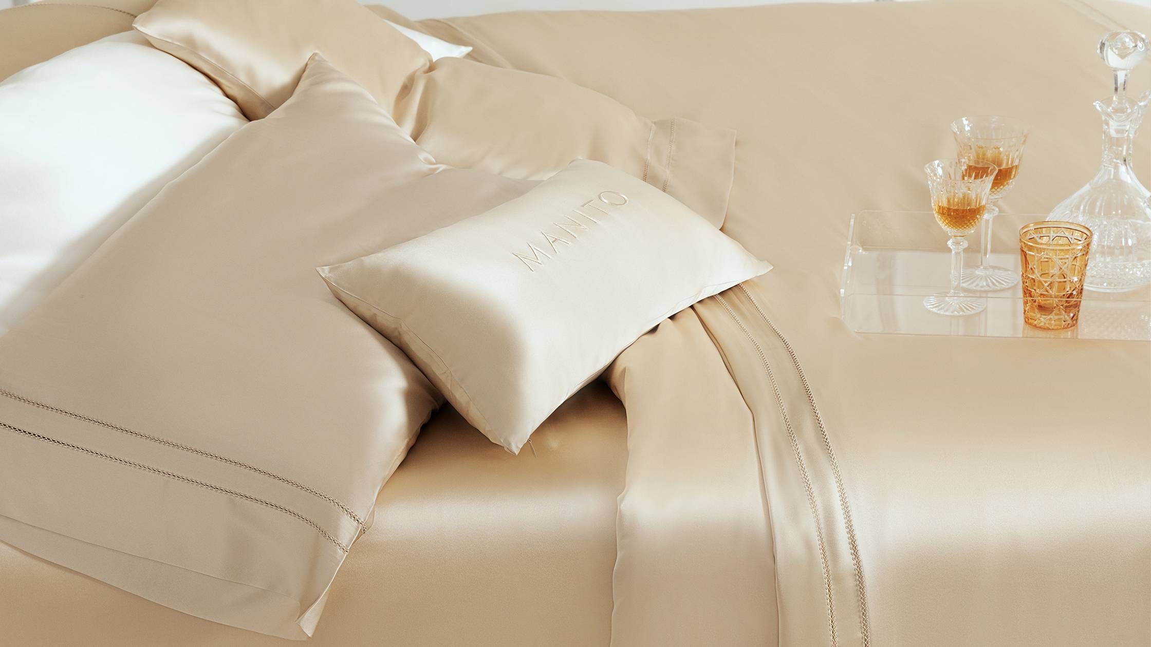 Elegant silk bedding with embroidered pillow, designed for comfortable sleep aiding in insomnia relief