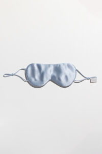 Single blue Cozy Silk Eye Mask with adjustable elastic band and smooth silk finish.