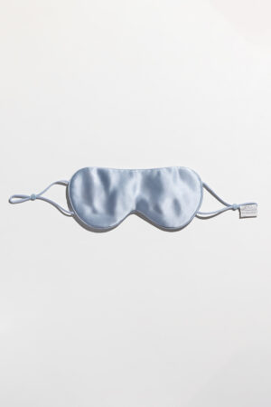 Single blue Cozy Silk Eye Mask with adjustable elastic band and smooth silk finish.