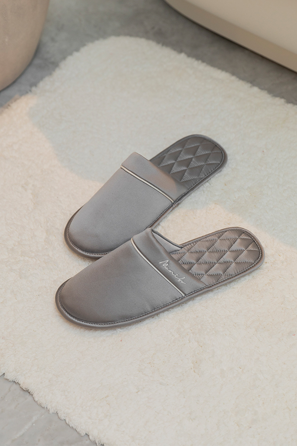 Authentic Men's Silk Lounge Shoes in grey, showing satin-silk finish with lamb-leather trim and the diamond-quilted insole detail.