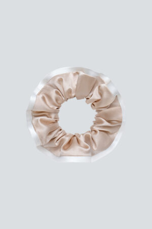 Two-tone Silk Scrunchie in champagne pairs peony-white edging with a gentle, snag-free hold for everyday styles.