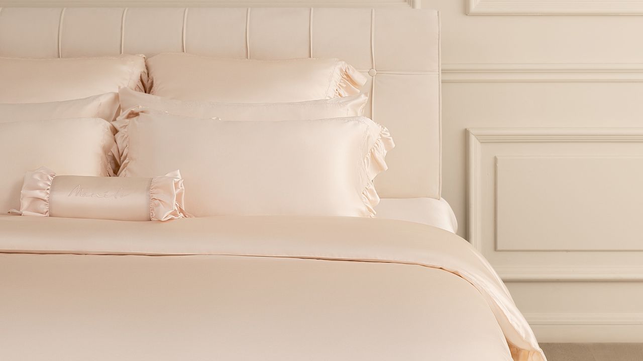 Allergy-prone individuals can enjoy the luxury and comfort of this bedroom with mulberry silk bedding, complete with cream frills.