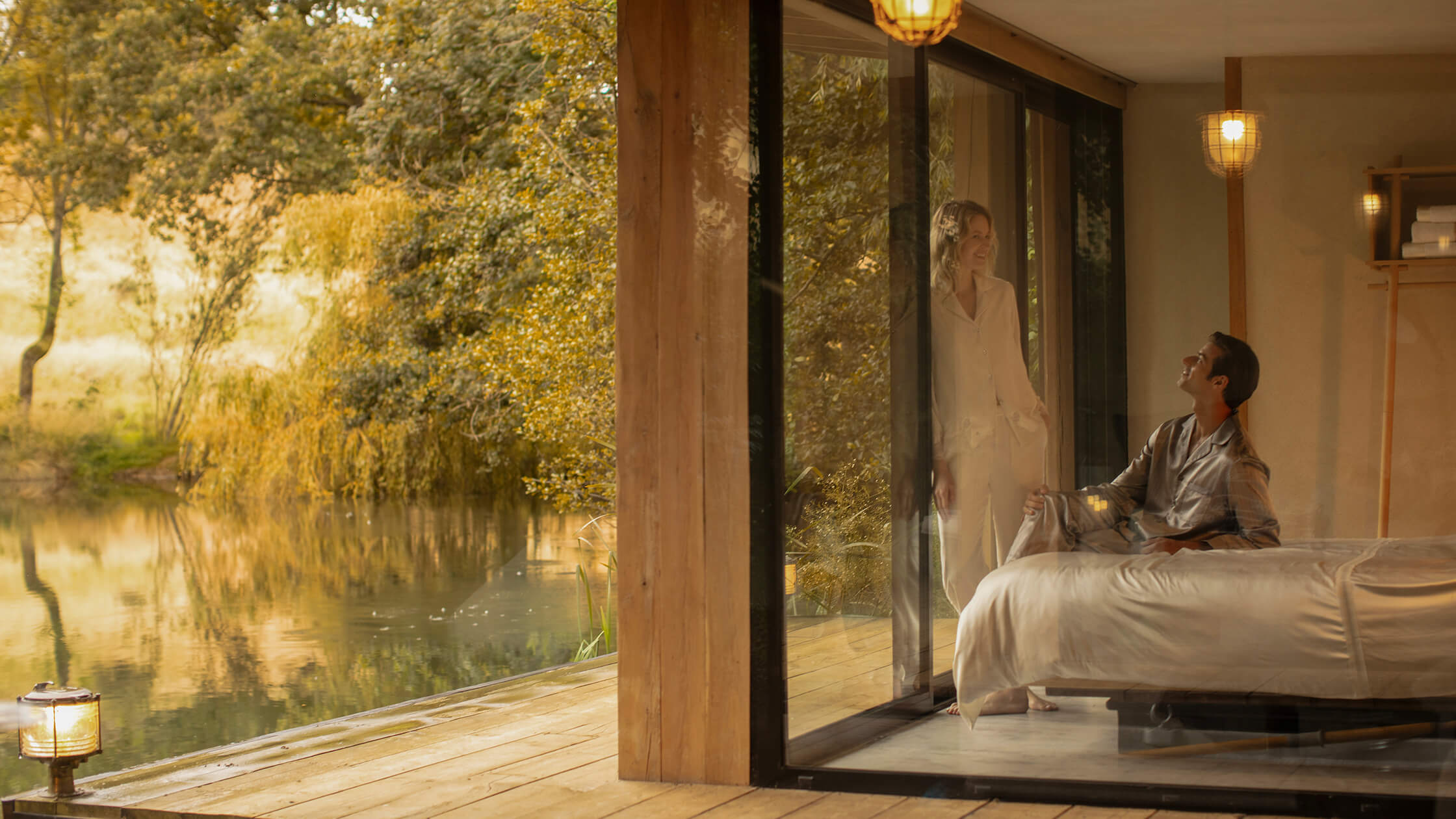 Luxurious silk bedding in a serene bedroom with nature view promoting better sleep quality.