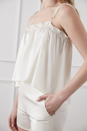 Side detail of the ivory Blooming Camisole & Shorts Set highlighting the ruched neckline and shorts with pockets.