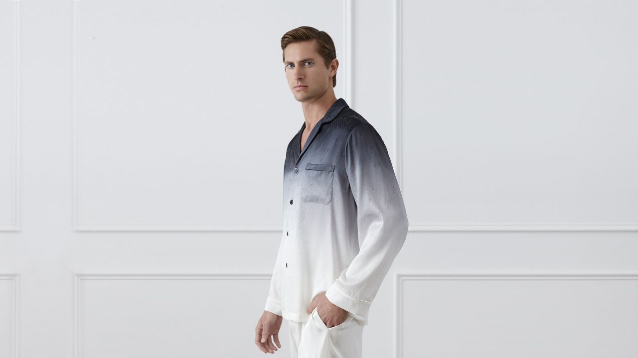Man in a gradient silk pajama shirt highlighting the benefits of silk during the winter for style and comfort.