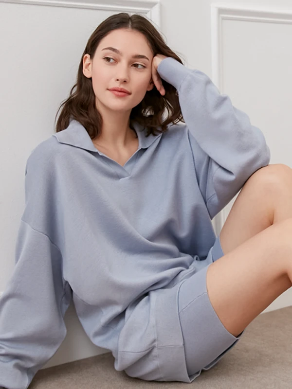 Model wearing MANITO's cream knit loungewear set with a relaxed, cozy silhouette.