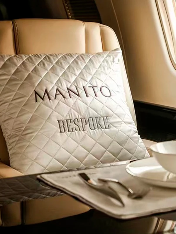 MANITO's personalized cushion with custom color and monogramming.