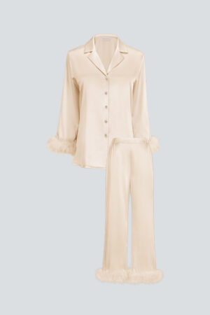 Flat lay of MANITO Diva Feather Trimmed Pajama Set in champagne, showing button-up top and matching pants with feather hems.