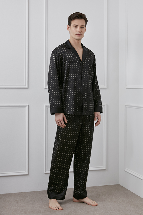 Smiling man wearing Signature MT Men's Pajama Set shows the comfort and luxury of the clothes.