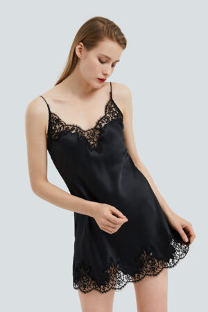 Woman wearing Flora Lace-trimmed Silk Slip Dress with delicate lace details for an elegant look.