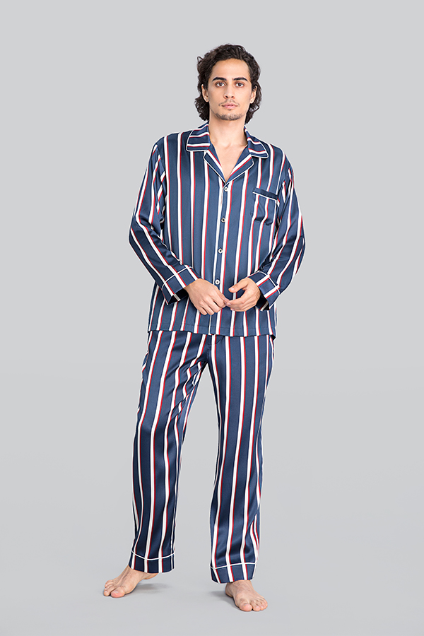 Man wearing Geom Men's Striped Silk Pajama Set, featuring Navy Blue, Crimson Red, and Crisp White Stripes, with a comfortable fit.