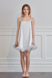 Front view of Diva Feather Women's Trimmed Short Slip Dress in white featuring a straight neckline and fluffy feather hem.